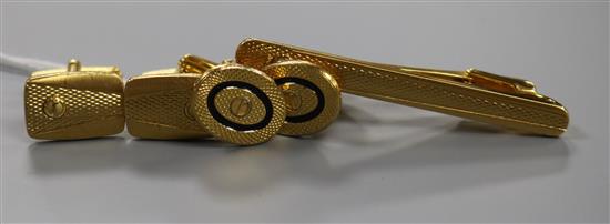 Two pairs of Dunhill engine-turned gold-plated cufflinks and a matching tie clip